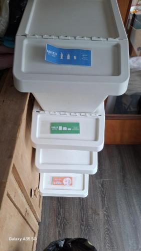 a plastic container is sitting on top of a refrigerator at Artisthostel Letterkenny in Letterkenny