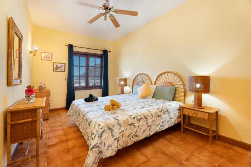 a bedroom with a bed with a teddy bear on it at Gigantes Apartament Sea View in Acantilado de los Gigantes