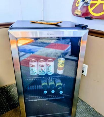 a small refrigerator with some drinks in it at The Zen Den in Hellertown