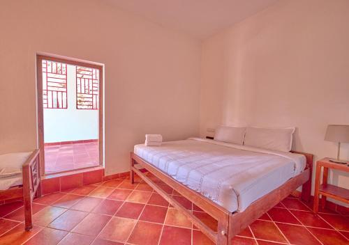 Postel nebo postele na pokoji v ubytování Jade Munnar Pool Resort