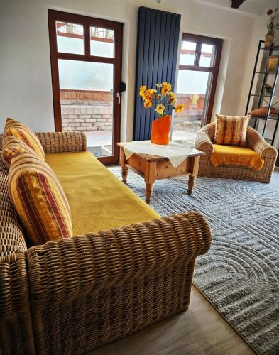 a living room with a bed and a couch and a table at FeWo Mallorca in Neue Scheune