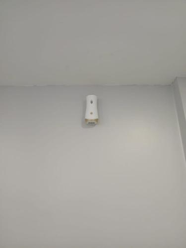 a white tile floor with a light on top of it at SS Grey Hotel kl in Kuala Lumpur