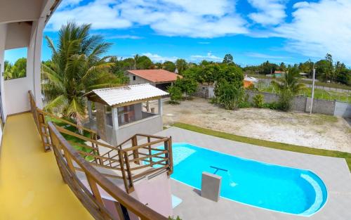 a view of the pool from the balcony of a villa at Recanto Berlin in Prado