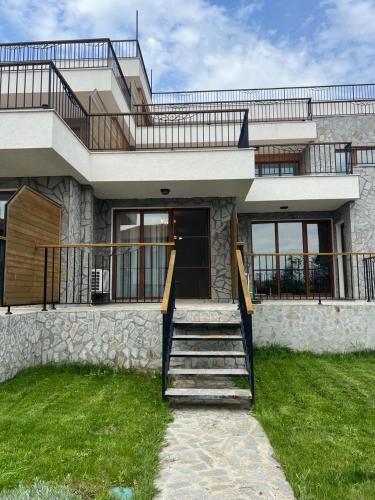 a house with a staircase in front of it at Vineyard Spa Resort Aheloy - Muscat-6 Studio in Kableshkovo