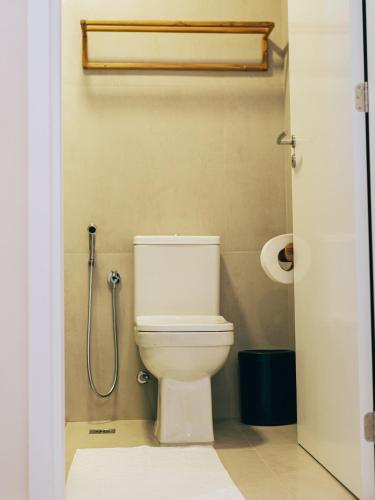 a bathroom with a toilet and a shower at Pipa Privilege Ocean Oficial in Pipa
