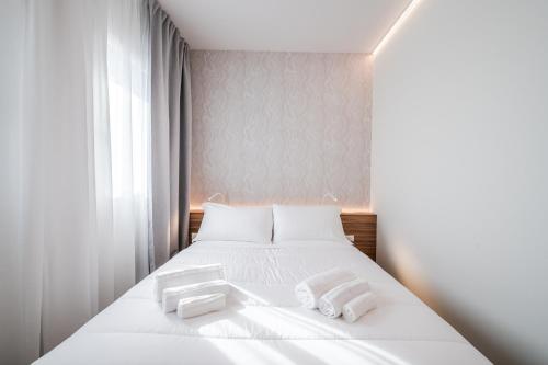 Ένα ή περισσότερα κρεβάτια σε δωμάτιο στο ELF apartments