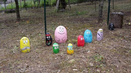 a group of painted eggs in the grass at B&B IL VECCHIO GELSO in Palinuro