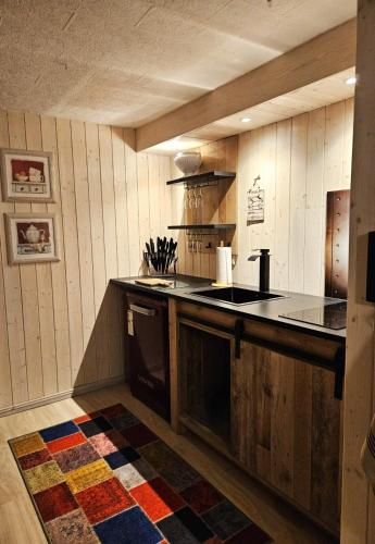 a kitchen with a sink and a counter top at FeWo Cuba in Neue Scheune