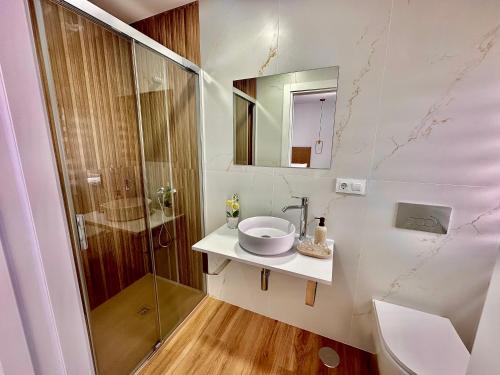 a bathroom with a sink and a shower at GH Beiramar in Cee