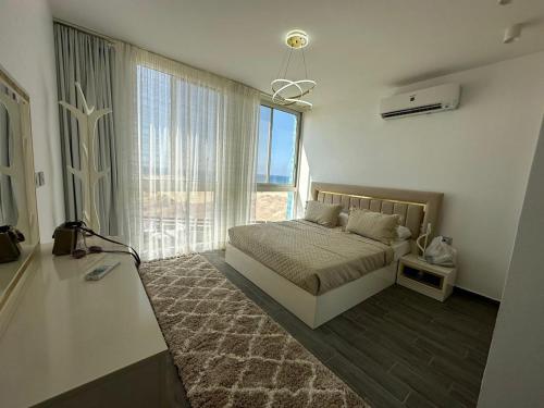 Ένα ή περισσότερα κρεβάτια σε δωμάτιο στο Shaheenz Hospitality