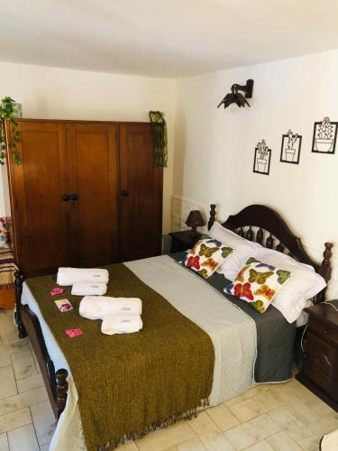a bedroom with a large bed with towels on it at Departamento la Oma in Posadas