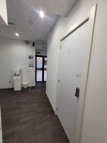 an empty room with a toilet and a door at AYZ Frailes - Auto check-in property in Málaga