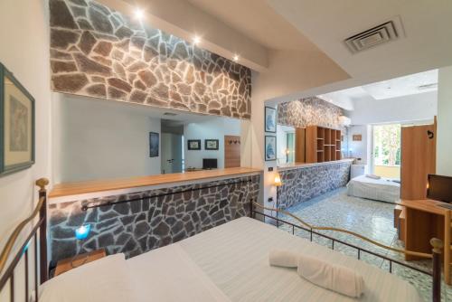 Postel nebo postele na pokoji v ubytování Hotel Pietra Verde