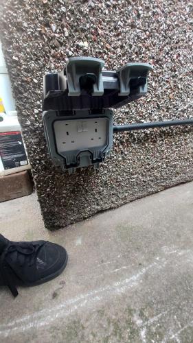a pair of shoes next to a pile of gravel at Phoenix Nights Guest House in Barrow in Furness