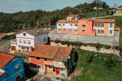 an aerial view of a town with buildings on a hill at La Casina de Maxa in Suares