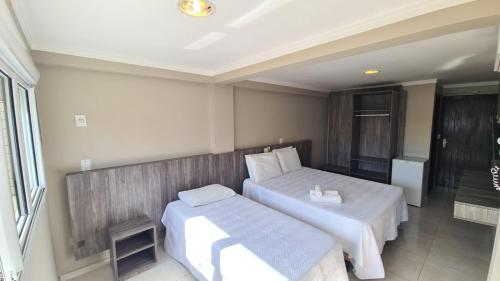 Ένα ή περισσότερα κρεβάτια σε δωμάτιο στο Hotel Jardim do Mar