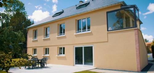 a house with a lot of windows at Château de Montmireil in Canisy