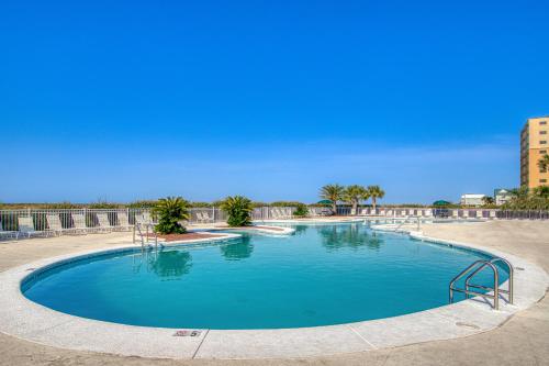 a large swimming pool with blue water at Plantation East 2205 in Gulf Shores