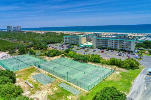 an aerial view of two tennis courts in front of a building at Plantation East 2205 in Gulf Shores