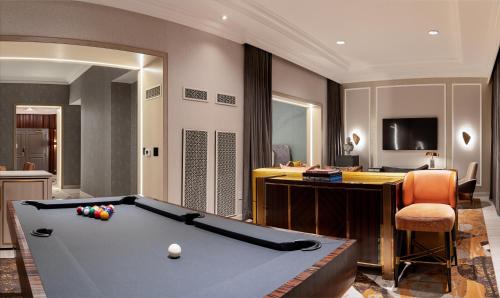 a living room with a pool table and a desk at The Venetian® Resort Las Vegas in Las Vegas