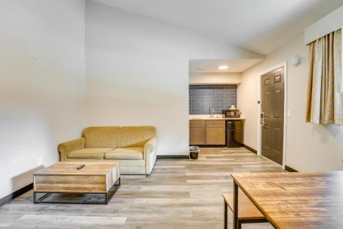 a living room with a couch and a table at 1 Mi to Riverfront Sleek Port Huron Studio in Port Huron