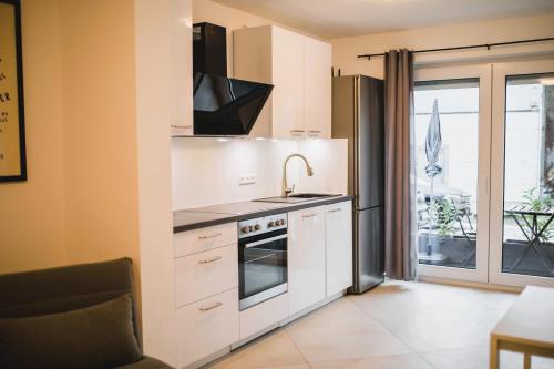 Kuchyň nebo kuchyňský kout v ubytování HUGOS Studio Apartment