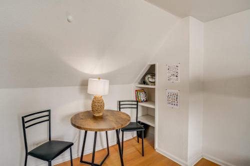 a small table with two chairs and a lamp on it at Walk to Beaches Waterfront Home in Port Orchard! in Port Orchard
