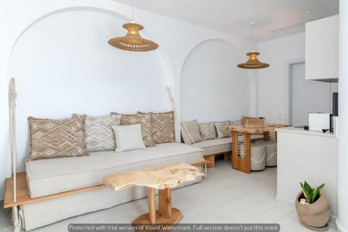 a living room with a couch and a table at Joyful Tinos in Tinos Town