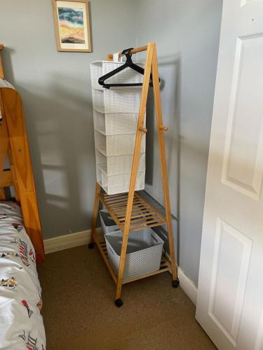 a wooden shelf with boxes on it in a bedroom at Bridlington chalet lodge 248 south shore holiday village with electric coin box in Bessingby