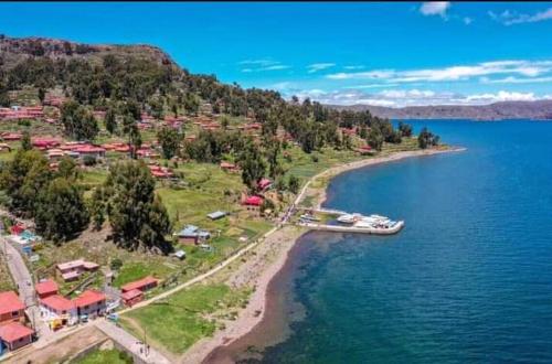 an aerial view of a resort on the shore of a lake at Vista Alegre in Puno