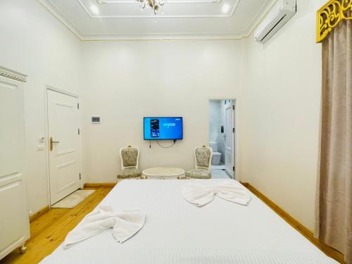 Postel nebo postele na pokoji v ubytování Atum