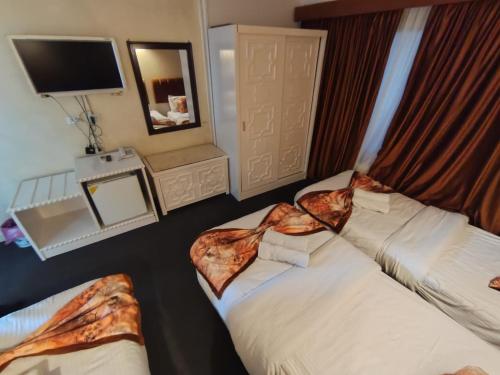 Cama o camas de una habitación en Cairo Heart Hotel By GH For Hotels