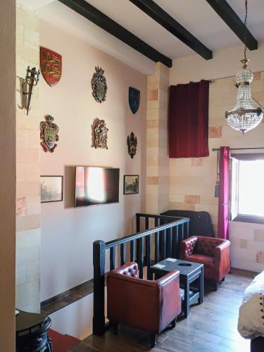 a room with chairs and decorations on the wall at Grand Master Suite in Rhodes Town