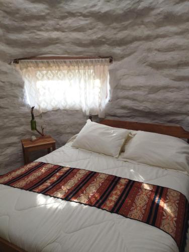 Postel nebo postele na pokoji v ubytování Ecodomos La Tongoycilla