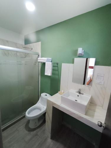 Um banheiro em Noas Hotel