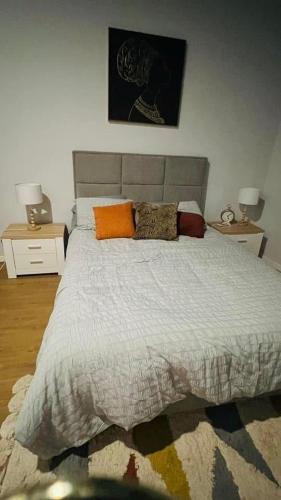 a bedroom with a large bed with pillows on it at Casa da Marina de Angra in Angra do Heroísmo