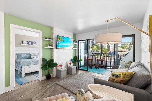 a living room with a bed and a living room with a couch at Anglers Cove Unit J205 in Marco Island