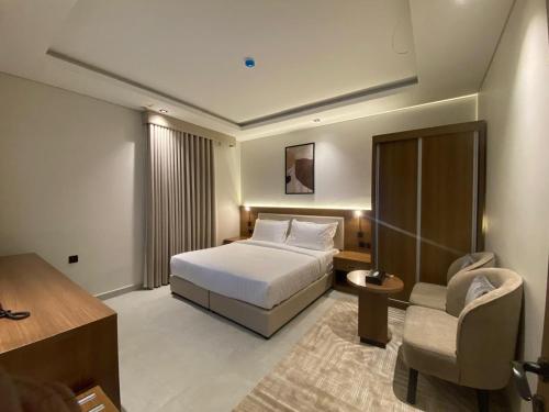 Postel nebo postele na pokoji v ubytování أونيسن للشقق المخدومة Onsen Serviced Apartments
