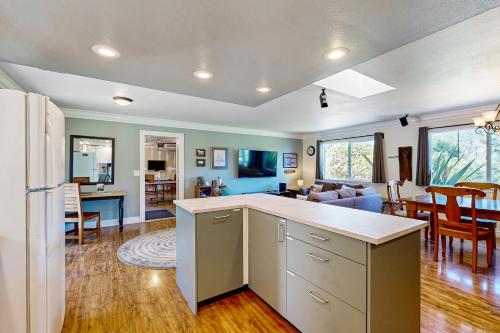 a kitchen and living room with a white refrigerator at Park View in Fort Bragg