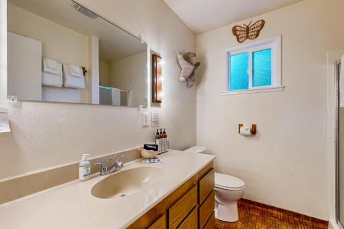 a bathroom with a sink and a toilet and a mirror at Park View in Fort Bragg