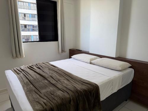 Ένα ή περισσότερα κρεβάτια σε δωμάτιο στο Edificio Neo Apto 602