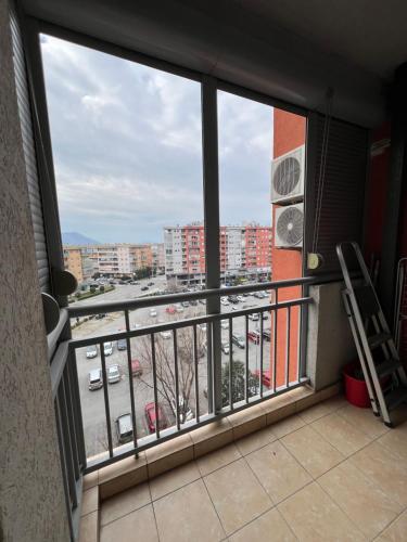 a balcony with a view of a parking lot at Apartman Marina in Podgorica