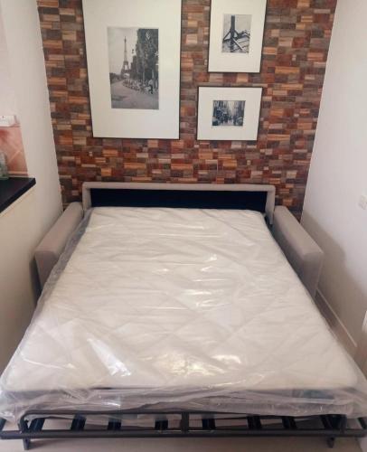 a mattress on a bed frame in a room at Beachfront studio in Sitio de Calahonda