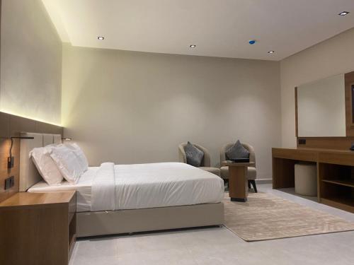 Postel nebo postele na pokoji v ubytování أونيسن للشقق المخدومة Onsen Serviced Apartments