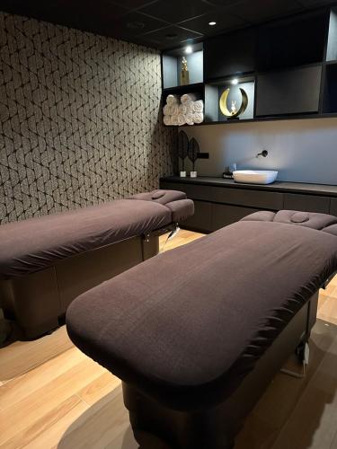 Una cama o camas en una habitación de O'Dreams Suite Wellness