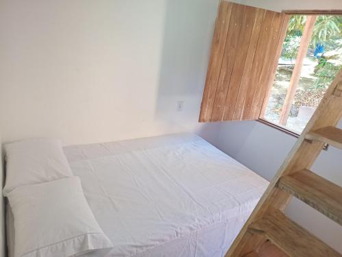 Ein Bett oder Betten in einem Zimmer der Unterkunft Quarto para 4 a 900 metros da Vila do Capão