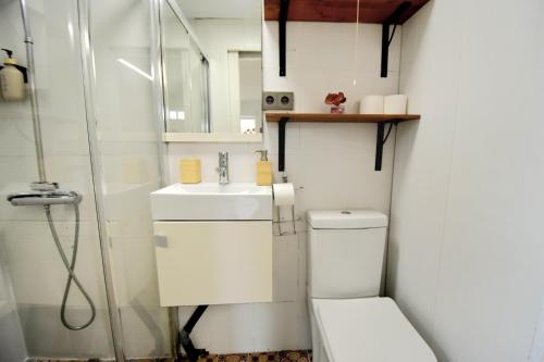 a bathroom with a toilet and a sink at Forest Escape near Barcelona in Sant Cugat del Vallès