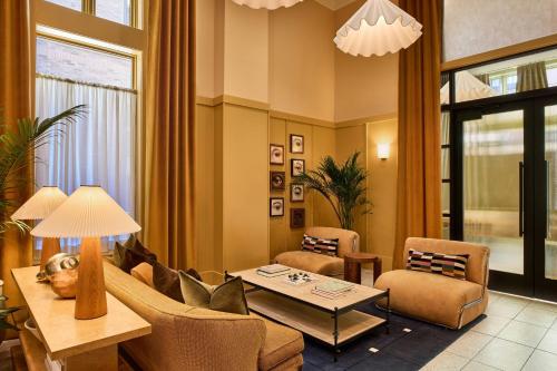 a living room with a couch and a table at The Ann Savannah, Apartments by Marriott Bonvoy in Savannah