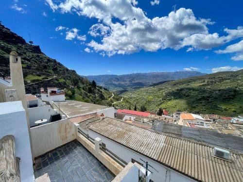 a view of the mountains from the roof of a building at El Balcón de Ohanes R&R in Ohanes