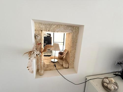 a room with a mirror on the wall at Domaine la Clausade in Mauguio